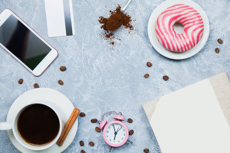 Background of coffee smartphone nuggets credit card, notebook, alarm clock. Freelancer conceptの写真素材