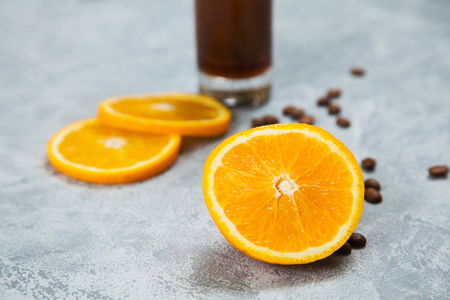 Bumble orange fresh juice coffee arabica espresso beans dark chocolate background. Time for coffee concept.の写真素材