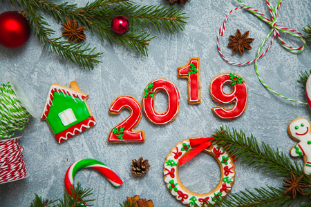 Christmas new year background greeting card gingerbread candy fir tree cones cinnamon holiday conceptの写真素材