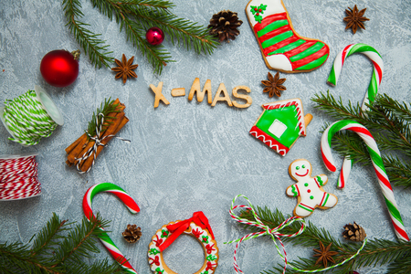 Christmas new year background greeting card gingerbread candy fir tree cones cinnamon holiday conceptの写真素材