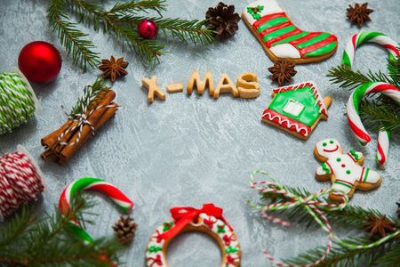 Christmas new year background greeting card gingerbread candy fir tree cones cinnamon holiday conceptの写真素材