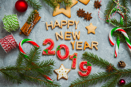 Christmas new year background greeting card gingerbread candy fir tree cones cinnamon holiday conceptの写真素材