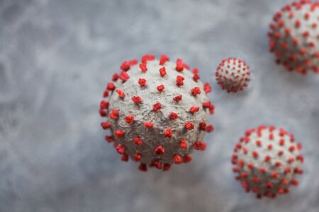 Creative photo of coronavirus sphere 3d model. Closeup macro selective focus shot of microscopic virus covid-19 molecule. Helthcare and medical concept.の写真素材
