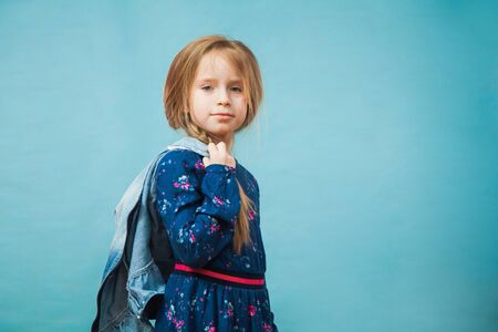 Pretty preteen girl in casual blue dress smile. Positive emotion, copy space for text, advertising concept.の写真素材