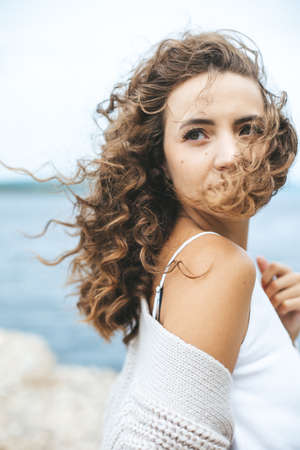 Natural light authentic portrait of young millenial woman outdoors.の写真素材
