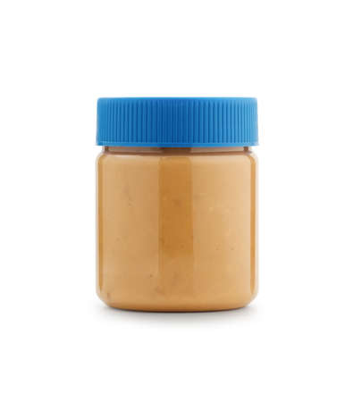 Coarse peanut butter in clear plastic Packaging With a blue lid isolated on white background.