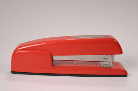 Red stapler on white backgroundの写真素材