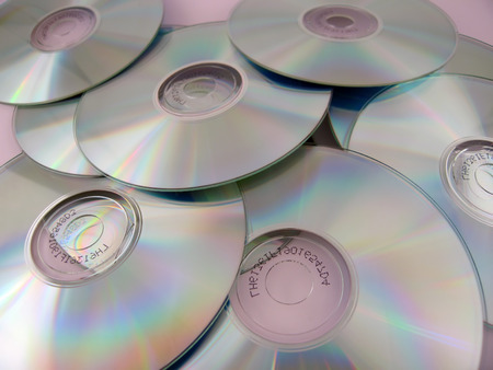 A number of CDs lying atop each other