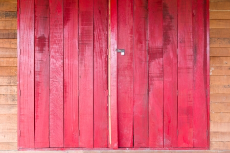 Old wooden red door, use as background texture の写真素材