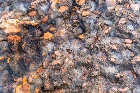 Texture of igneous rock with uneven surfaceの写真素材