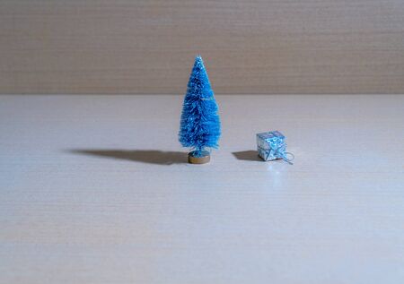 Tree with fake Christmas packages on the floorの写真素材