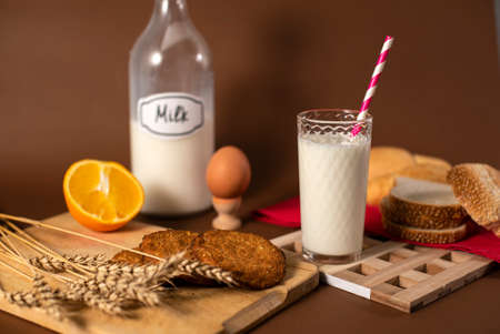 Glass of Fresh Milk, Oatmeal Cookies, Egg and Fruits. Healthy and Delicious Breakfast