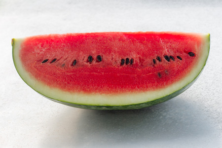 Slice of watermelon on white backgroundの写真素材