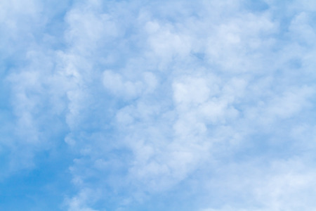 Blue sky with clouds backgroundの写真素材