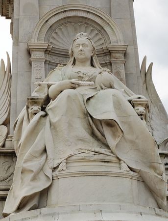Detail of the marble statue of Queen Victoria at the gates of Buckingham Palace in Londonの写真素材