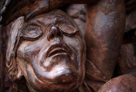 Detail of a sculpture featuring an old woman looking at the sky with fearの写真素材