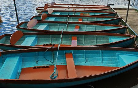 Row of boats in a river dockの写真素材