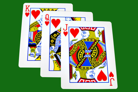 King,Queen and Jack of hearts iolated on green with clipping pathのeditorial素材