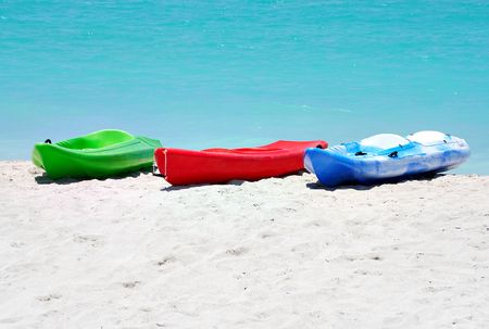 Group of kayaks ready to be rented in a beachの写真素材