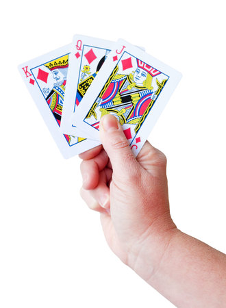 Hand holding a set of playing cards isolated on whiteのeditorial素材