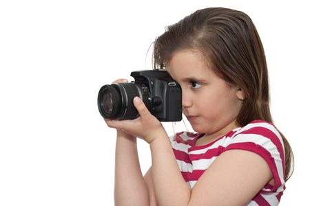 Young girl taking a picture with a professional camera on a white background