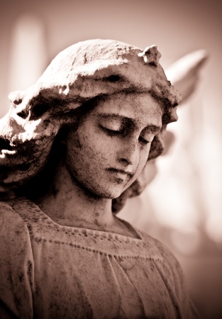 Weathered young angel in sepia tonesの写真素材