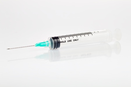 Disposable syringe on a white backgroundの写真素材