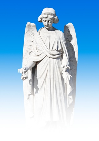 Young female angel statue on a sky backgroundの写真素材