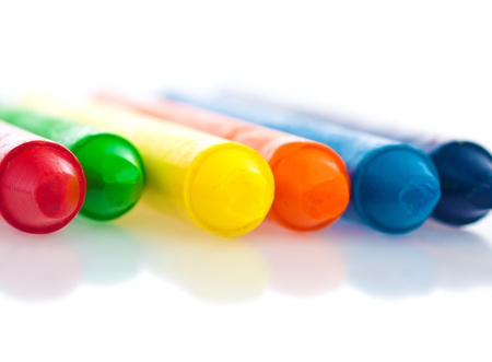 Close up image of color crayons with reflections on a white backgroundの写真素材