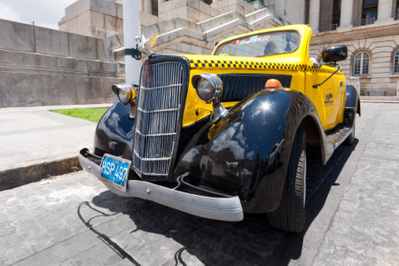HAVANA-JUNE 4:Ford from 1937 in front of the Capitol June 4,2011 in Havana.Cubans keep thousands of classic cars running,many of them working as taxis,and they've become an icon of the countryのeditorial素材