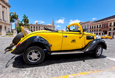 HAVANA-JUNE 4:Ford from 1937 in front of the Capitol June 4,2011 in Havana.Cubans keep thousands of classic cars running,many of them working as taxis,and they've become an icon of the countryのeditorial素材