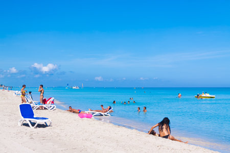 VARADERO,CUBA-JULY 16:Tourists enjoying the beach July 16,2011 in Varadero.With approximately a million visitors per year,Varadero is most important destination for the growing cuban tourist industryのeditorial素材