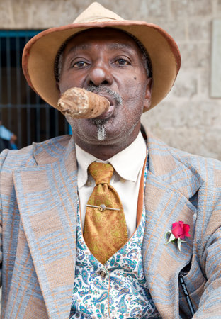 HAVANA-MARCH 28:Old elegant man with a huge cuban cigar March 28,2011 in Havana.A symbol of Cuba,cigars are the most prestigious product of the island attracting visitors from all over the worldのeditorial素材