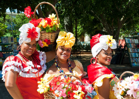 HAVANA-OCTOBER 20:Women in typical clothing October 20,2011 in Havana.With the growth of foreign tourism people like these,working for tips,make their living posing as traditional cuban charactersのeditorial素材