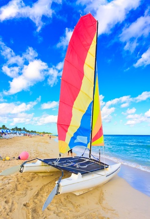Sailing catamaran in the beautiful cuban beach of Varaderoの写真素材