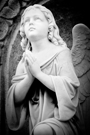 Beautiful marble angel in an old gothic churchの写真素材