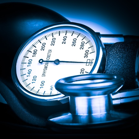 Blue toned sphygmomanometer and stethoscope kit used to measure blood pressureの写真素材