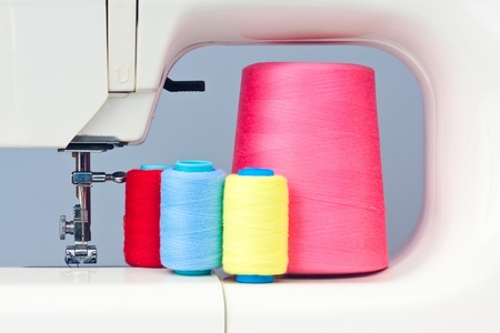 Sewing machine and colorful thread bobbinsの写真素材