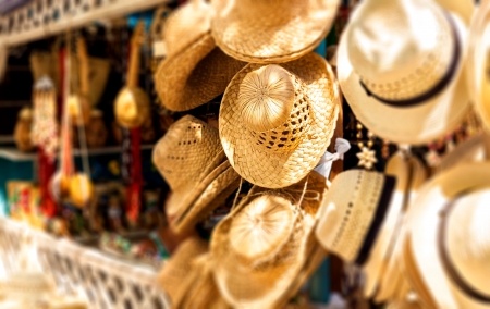 Street market selling hats and souvenirs in the touristic town of Varadero in Cuba photographed with a shallow depth of fieldの写真素材