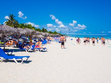 Group of young tourists enjoying the beach of Varadero in Cubaのeditorial素材