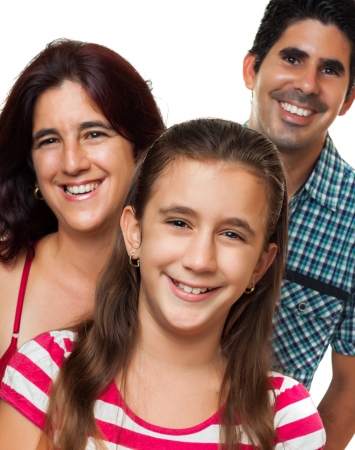 Portrait of a happy hispanic family consisting of father,mother and daughter isolated on a white backgroundの写真素材