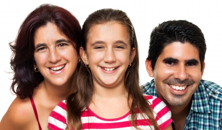 Portrait of a happy hispanic family consisting of father,mother and daughter isolated on a white backgroundの写真素材
