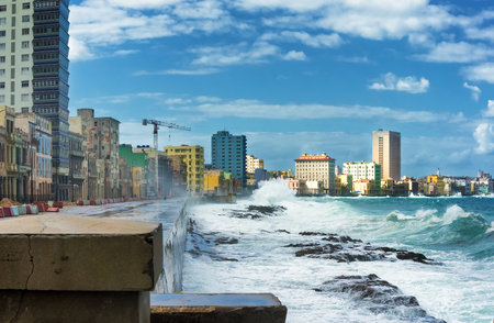 Skyline of Havana during a hurricane with big waves crashing against the seaside wallのeditorial素材