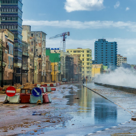 Havana during a hurricane with big waves crashing against the seaside wall and debris on the streetのeditorial素材