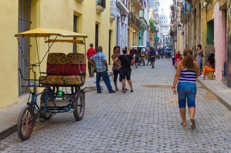 Cuban people in the street on an old neighborhood in Havana Founded in 1515,Havana is the largest city in the Caribbean with 2 4 million inhabitantsのeditorial素材