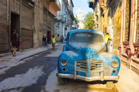 Street scene with an old rusty american car  in Havana These classic vintage cars that can be seen all over the country have become a worldwide known symbol of Cubaのeditorial素材