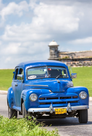 Vintage american car near the castle of El Morro on June 16, 2013 in Havanaのeditorial素材