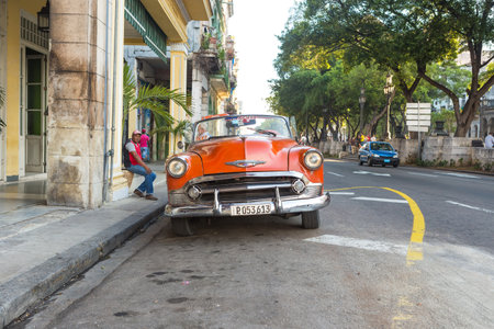 Vintage red Chevrolet parked near El Prado street  in Havanaのeditorial素材