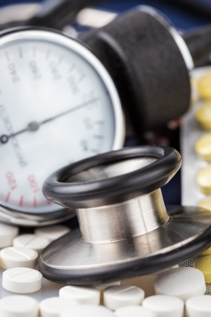 Pills, stethoscope and sphygmomanometer  used to measure blod pressure の写真素材
