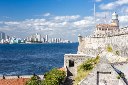 The fortress and lighthouse of El Morro with the Havana skylineの写真素材